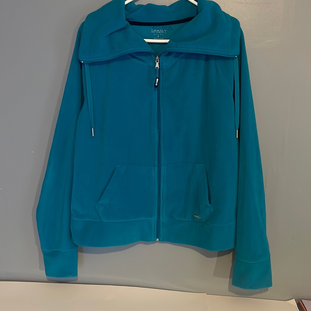 Calvin Klein Teal Zip Up Fleece Jacket with thumb hole on side a of arms